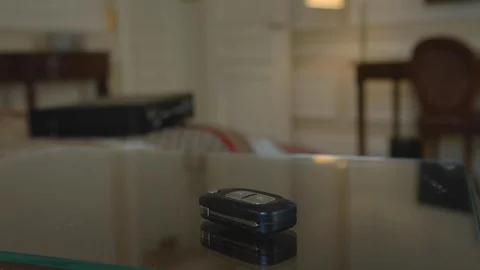 Car key resting on the glass table of a room of famous vintage luxury hotel, Видео 110770917