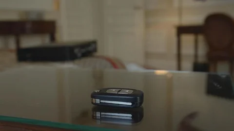 Car key resting on the glass table of a room of famous vintage luxury hotel, Video stock 110770918