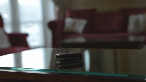 Car key resting on the glass table of a room of famous vintage luxury hotel, Stock Footage 110770925