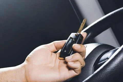 Car keyless entry remote in the owner hand on the car Foto stock