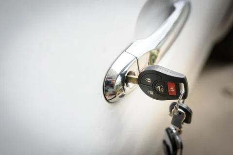 Car keys left in a lock Stock Photos