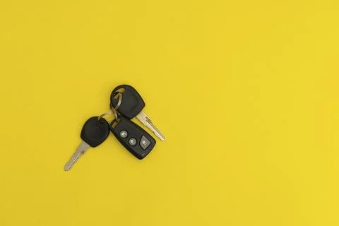 Car keys on yellow background Stock Photos