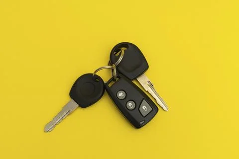 Car keys on yellow background Stock Photos