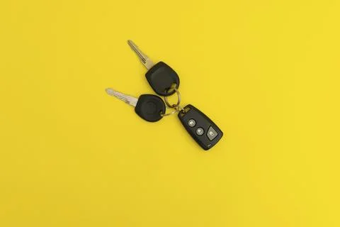 Car keys on yellow background Stock Photos