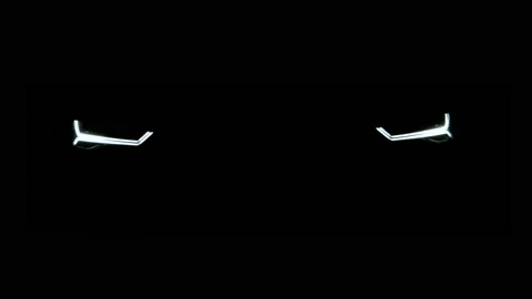 Car LED headlights turning on in complete darkness dramatic cinematic look Stock Footage 221863379