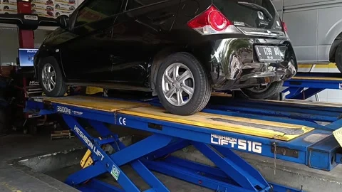 Car Lifted in auto service Stock Footage 239000691