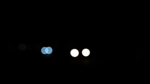 Car light at night. car light bokeh at night. moving defocused light background Stock Footage 291257846
