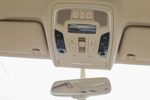 Car light panel on the top with buttons, air conditional and sun box. Stock Photos
