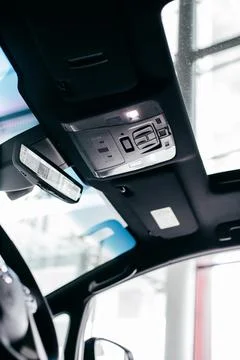 Car light panel on the top with buttons, air conditional and sun box Stock Photos