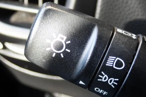 CAR LIGHTING HEADLAMP  button inside a car. Crop fragment. Photos