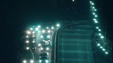 Car lights and side lights in night traffic on all lanes of the highway  Stock Footage 313159061