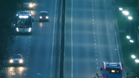 Car lights and side lights in night traffic on all lanes of the highway  Stock Footage 313222227