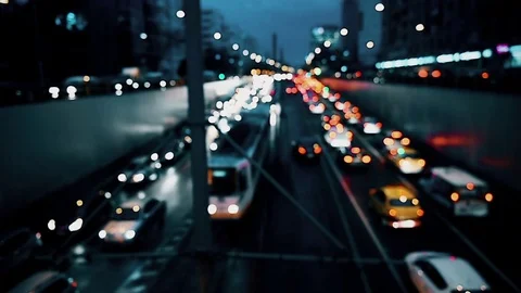 Car lights are seen in a night scene with urban traffic congestion Vidéo 73276153