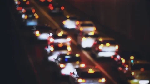 Car lights are seen in a night scene with urban traffic congestion 스톡 동영상 73276158