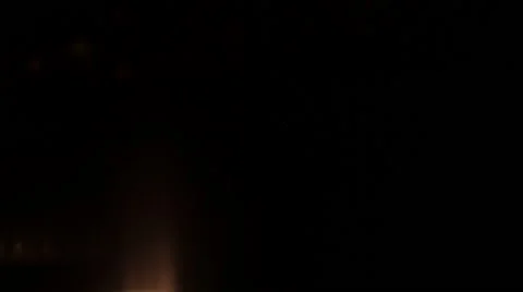 Car lights lit up at night Stock Footage 44474763