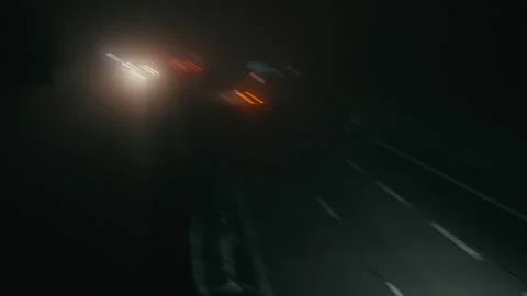 Car Lights Moving Fast on a Dark Highway at Night with Blurred Motion 库存影片 331164289