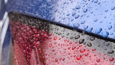 Car lights in raindrops close-up. Raindrops run down the headlights makr plan Stock-Footage 161246921