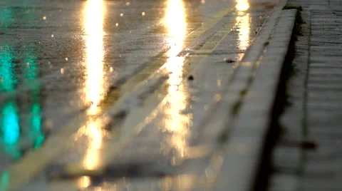 Car lights reflecting on wet road in the rain Stock Footage 44017723