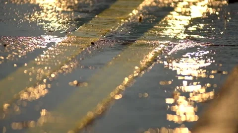 Car lights reflecting on a wet road during rain Stock Footage 44018980