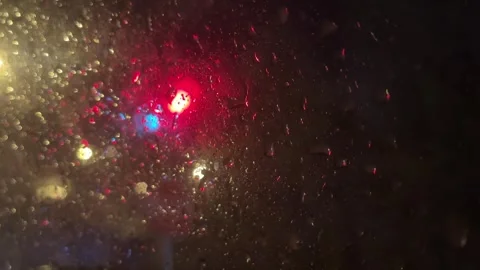 Car lights through a rainy window Stock Footage 260843672