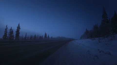 Car lights in winter forest Stock Footage 84270581