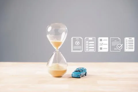 Car loan payment approval process unfolds, hourglass shows time passing, ve.. Stock Photos