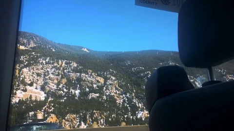In a Car Looking at Mountains Stockbeeldmateriaal 84711227