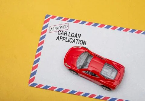 Car low application concept with post card on yellow background Foto stock