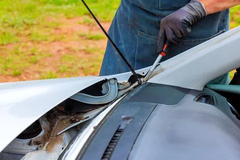 Car maintenance involves checking engine components ensuring everything is 写真素材