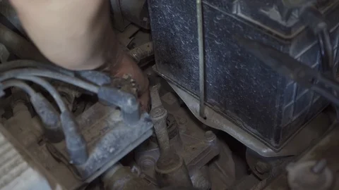 Car maintenance selective focused on hand of worker fix something of engine Stock Footage 126146157