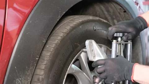 The car mechanic adjusts the car control system. Car service. Diagnosis of a new Stock Footage 199097140