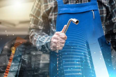 Car mechanic with car engine on background; multiple exposure Foto stock