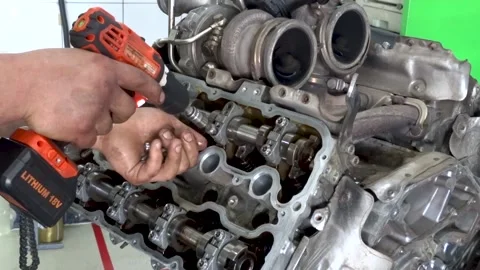 A car mechanic disassembles the engine Stock Footage 169828061