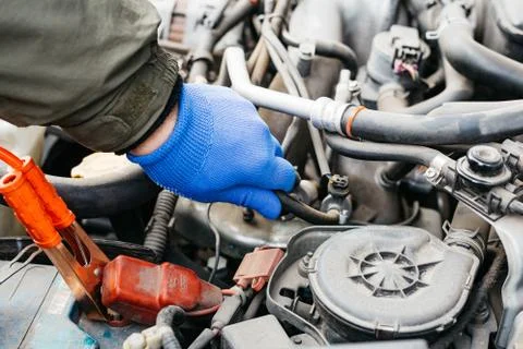 Car mechanic engineer checking, fixing the car, making maintenance comprehens Stock Photos