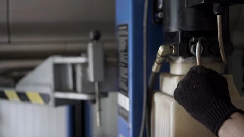 Car mechanic makes a car in the workshop Vídeo Stock 110845894