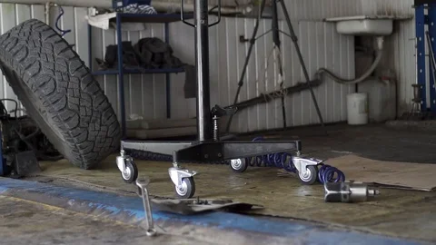 Car mechanic makes a car in the workshop Stock Footage 110845957