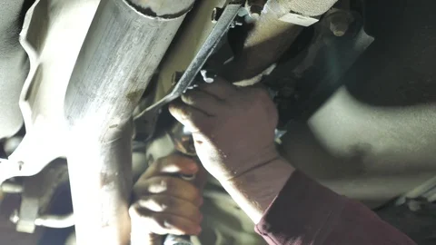 Car mechanic repairs a car Stock Footage 128762987