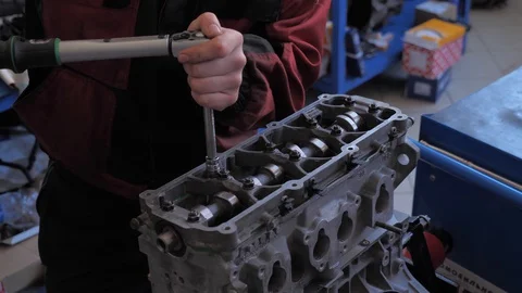 Car mechanic repairs a car Stock Footage 128763334