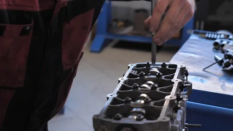 Car mechanic repairs a car Stock Footage 128763431