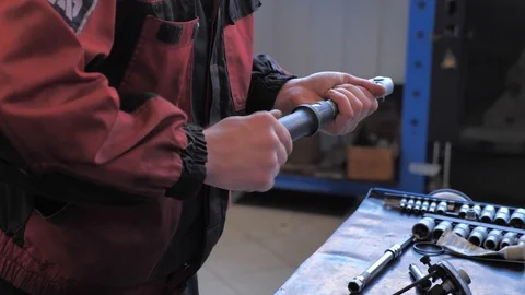 Car mechanic repairs a car Stock Footage 128763477