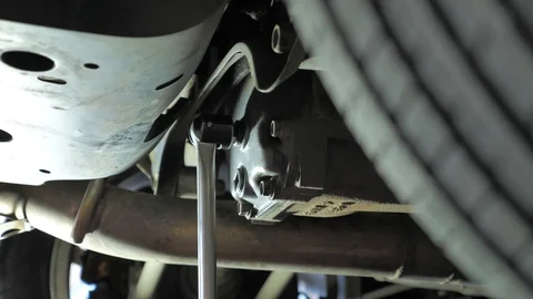 Car mechanic repairs a car Stock Footage 128763604