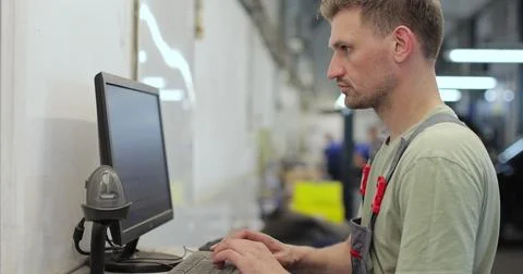 Car mechanic using computer to run diagnostic software for troubleshooting .. Stock Photos