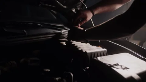 Car mechanic at work, close up of a man repairing his car. Stock Footage 145903371