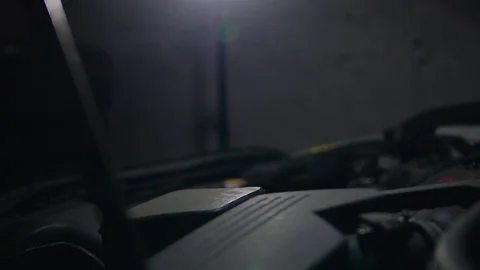 Car mechanic working on the car engine in the garage Stock Footage 129269400
