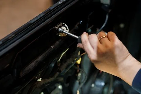 Car Mechanic Working on Engine Component with Socket Wrench 스톡 사진