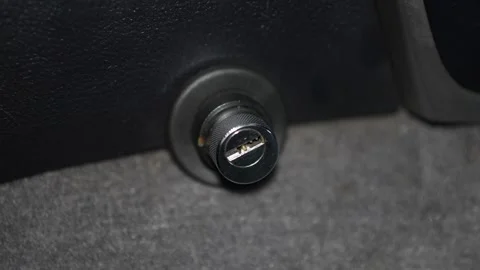 Car mechanical gear shift lock cylinder (like Bear-Lock or Construct) install Stock Footage 344597090