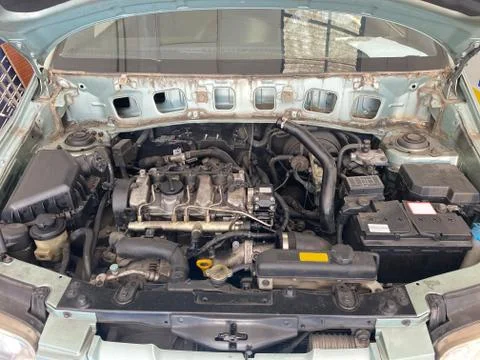 Car in mechanical workshop, front view of the engine. Lifestyle concept. Stock Photos