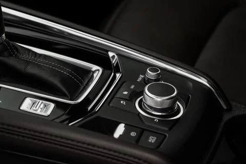 Car media controller close up. Modern car media and navigation control button Stock Photos