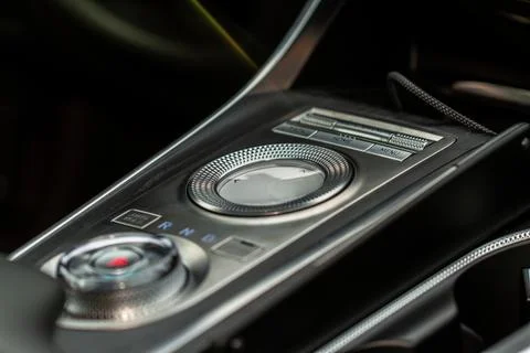 Car media controller close up. Modern car media and navigation control button Stock Photos