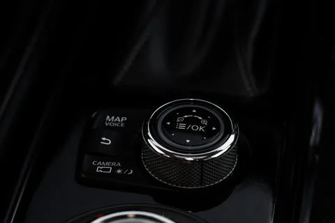 Car media controller close up. Modern car media and navigation control button Stock Photos